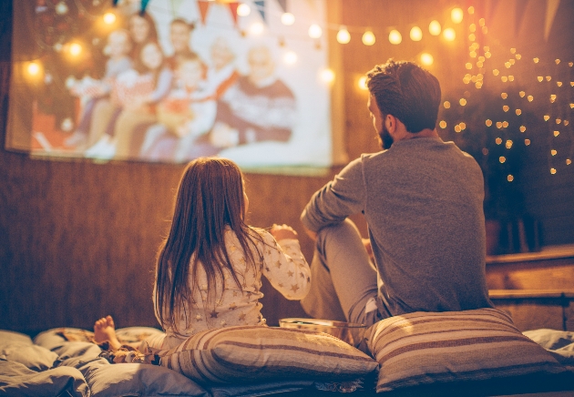 Couple watching a film outside