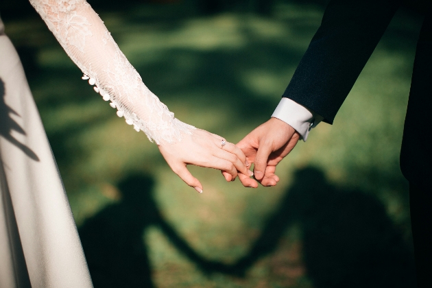 A man and woman holding hands