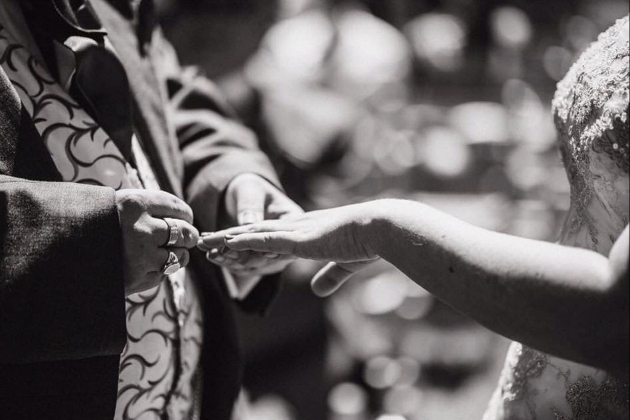 A man and women exchanging rings