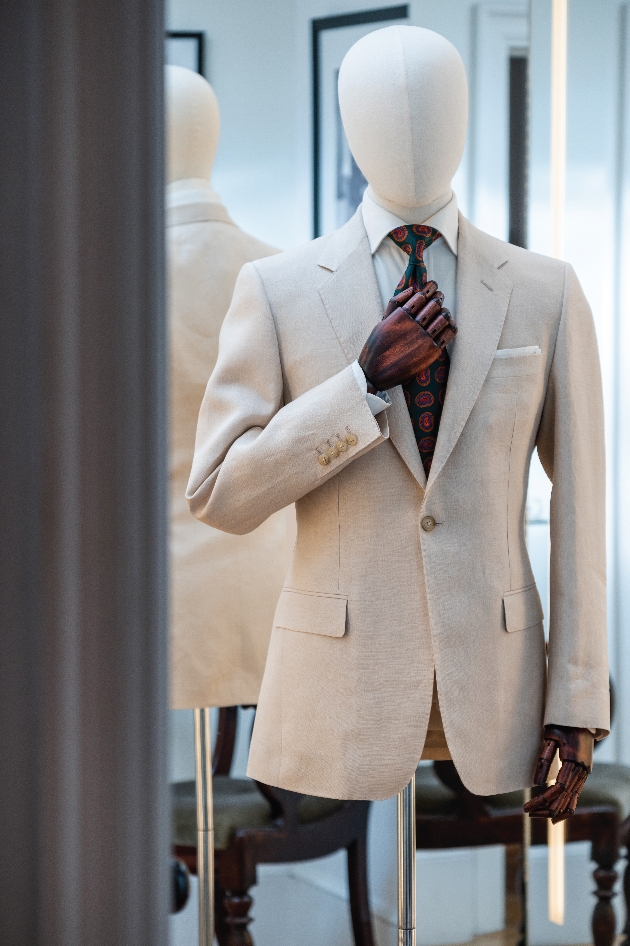 A cream jacket on a mannequin 