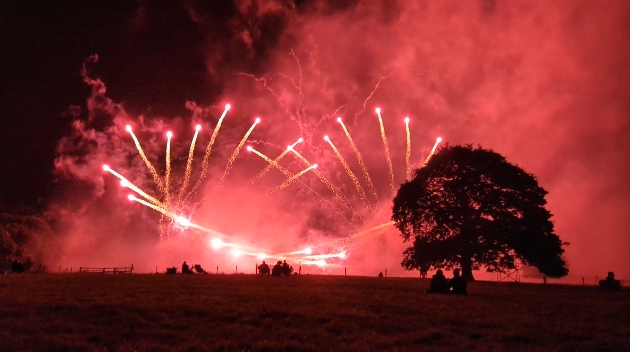 A red sky filled with fireworks